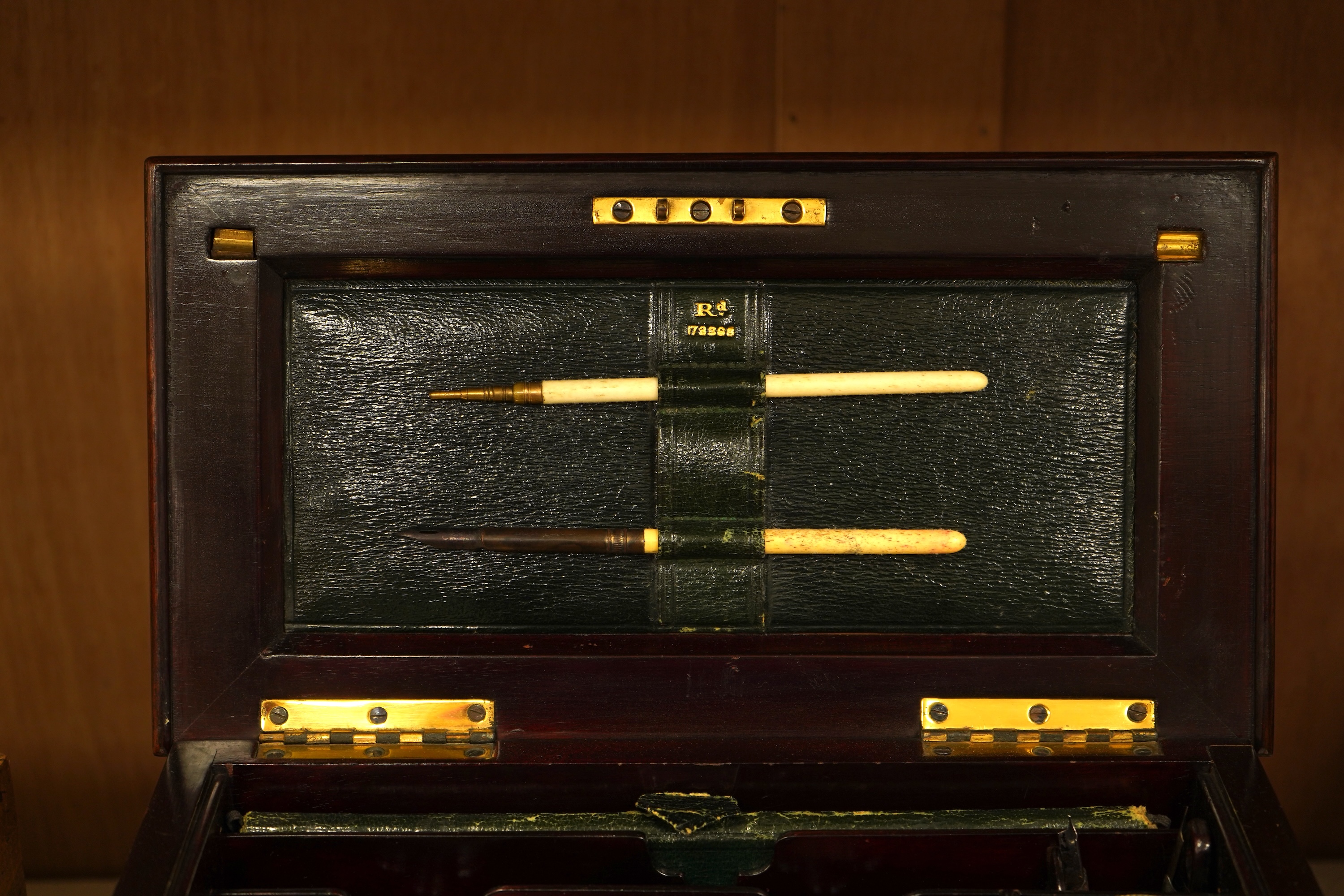 An Edwardian inlaid mahogany writing casket with fitted interior and a late Victorian faded walnut cigar box, largest 32cm wide